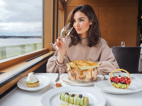 Woman drinking wine at restaurant