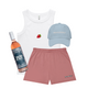 White tank top with strawberry graphic, pink shorts, blue cap, and 'Mom Juice' bottle on a white background